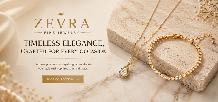 Gold necklace and tennis bracelet on a cream travertine stone
